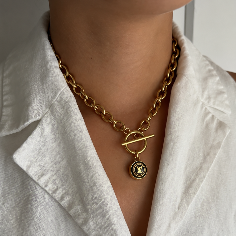 Vintage Louis Vuitton sleutelhanger bedel rond met lv | Ketting