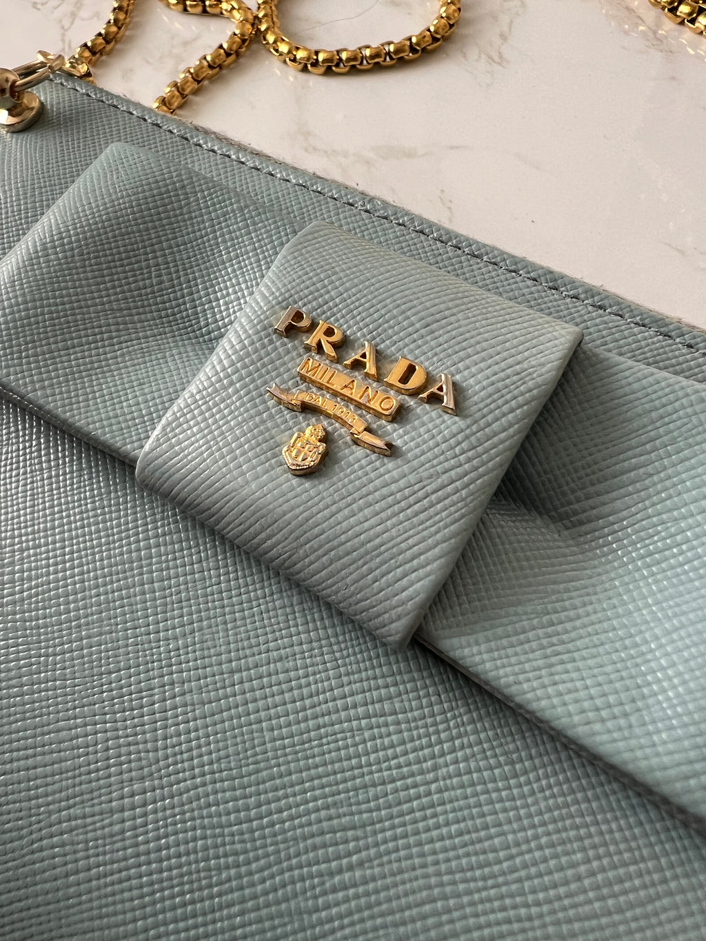 Prada saffiano blue ribbon