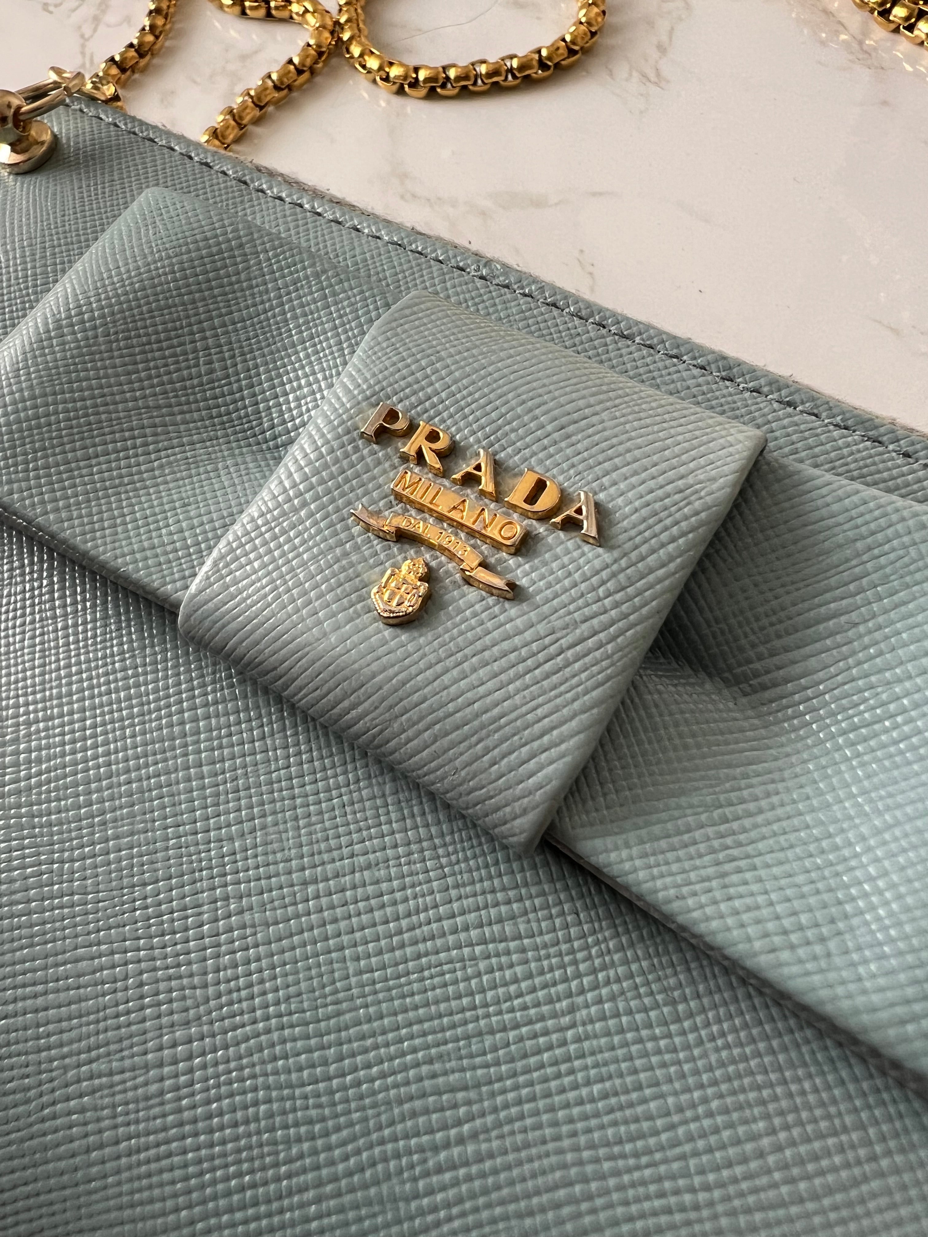 Prada saffiano blue ribbon